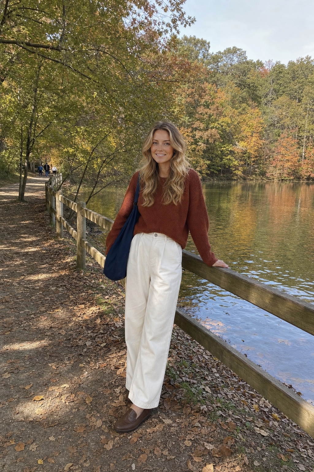 Casey Brennan beside a lake in autumn